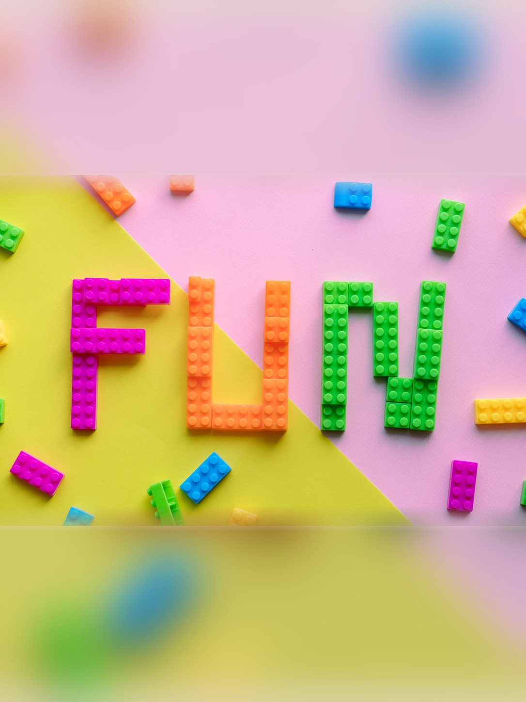 Colorful building blocks spell “FUN.”