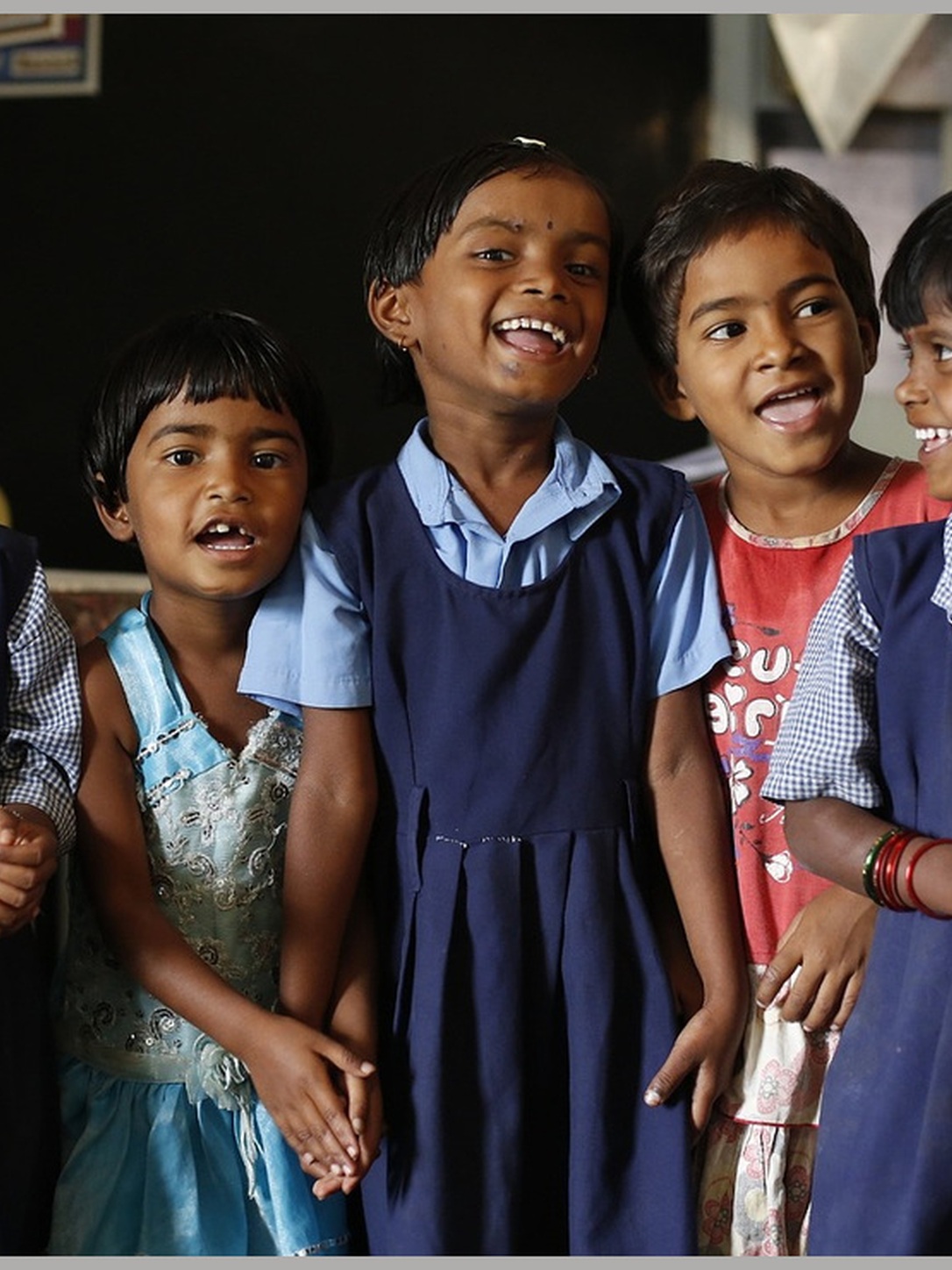 Young students participate enthusiastically in a classroom activity.