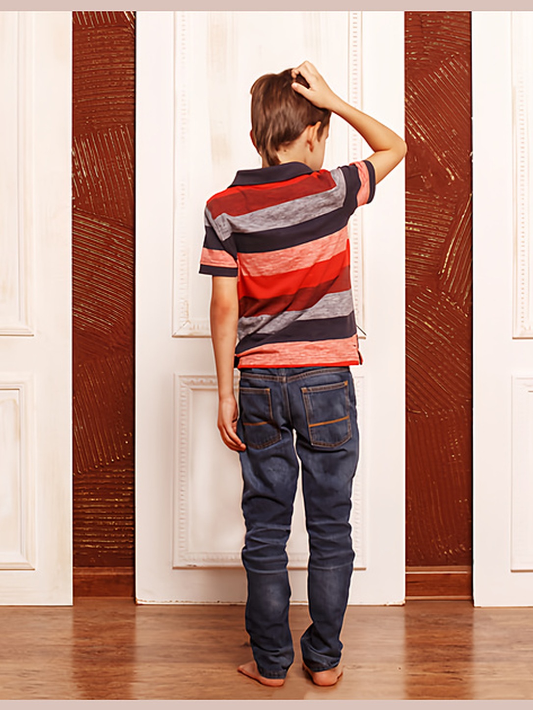 A child stands thoughtfully before three doors.