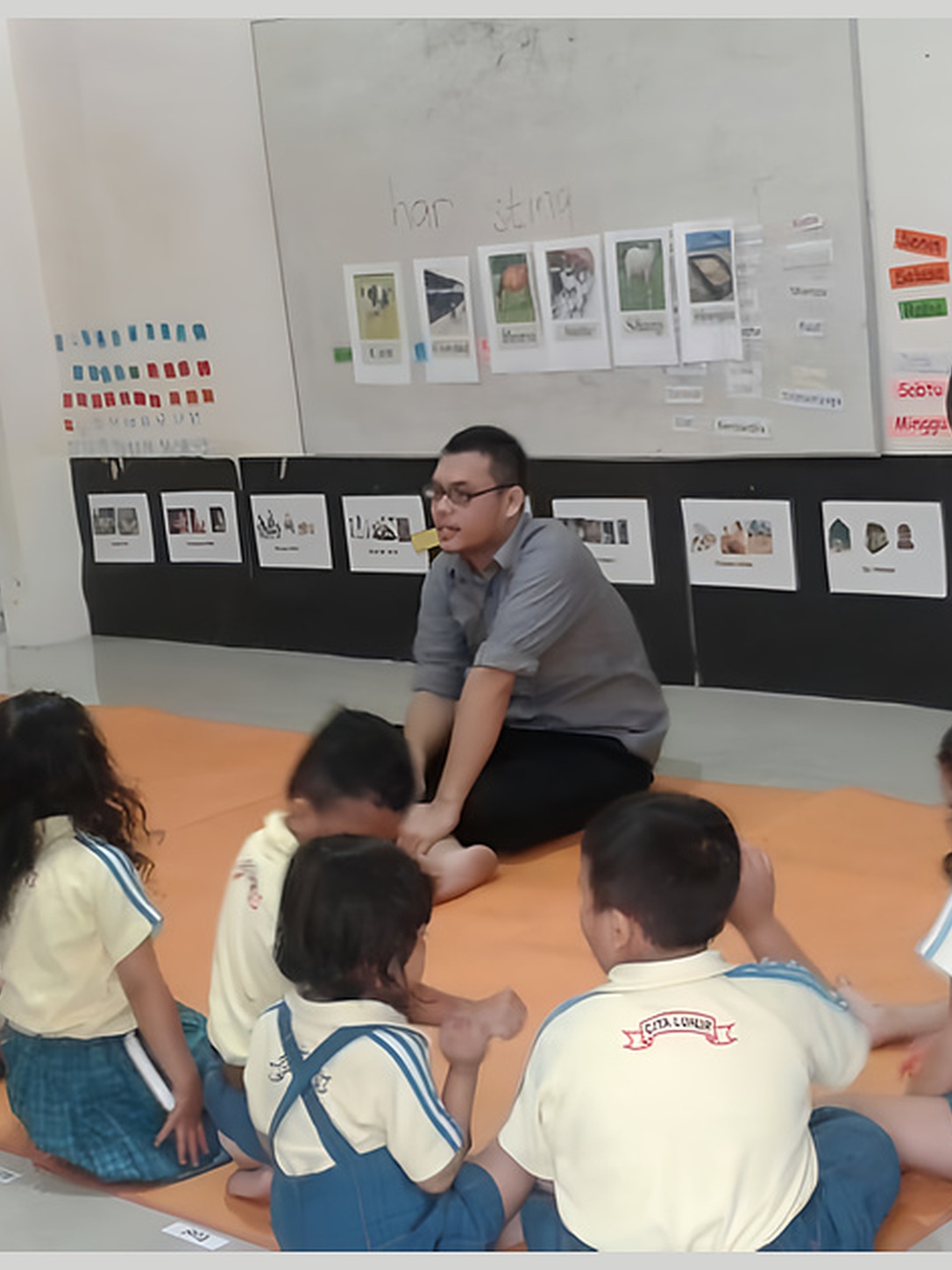 A teacher leads a circle activity with young students.