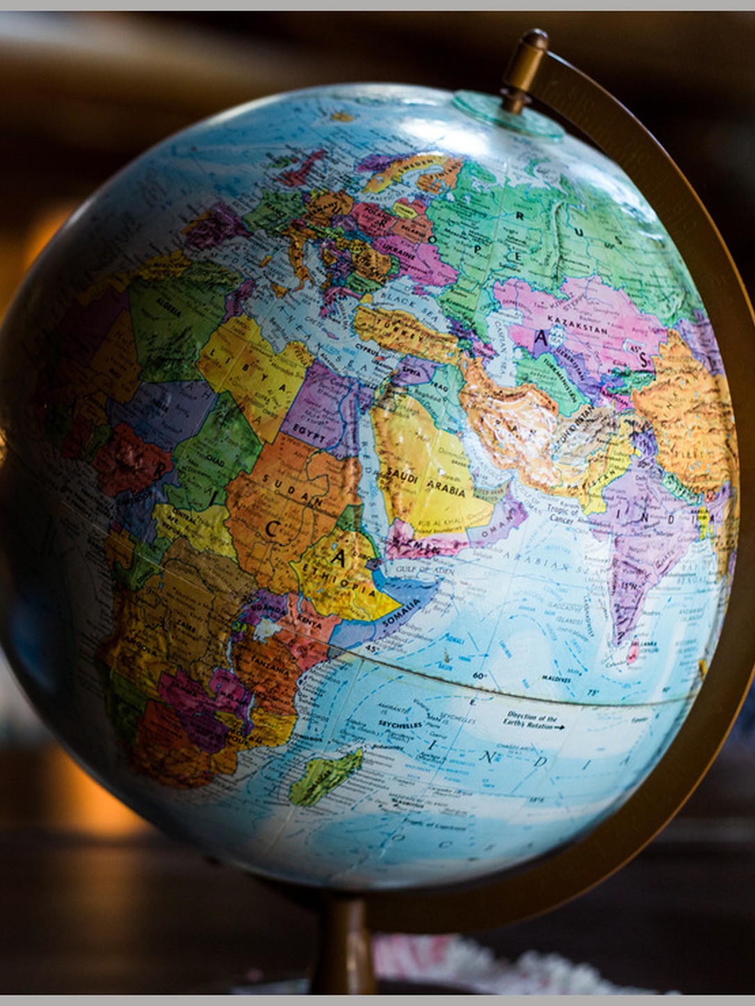 A globe displays Africa, Europe, and Asia.