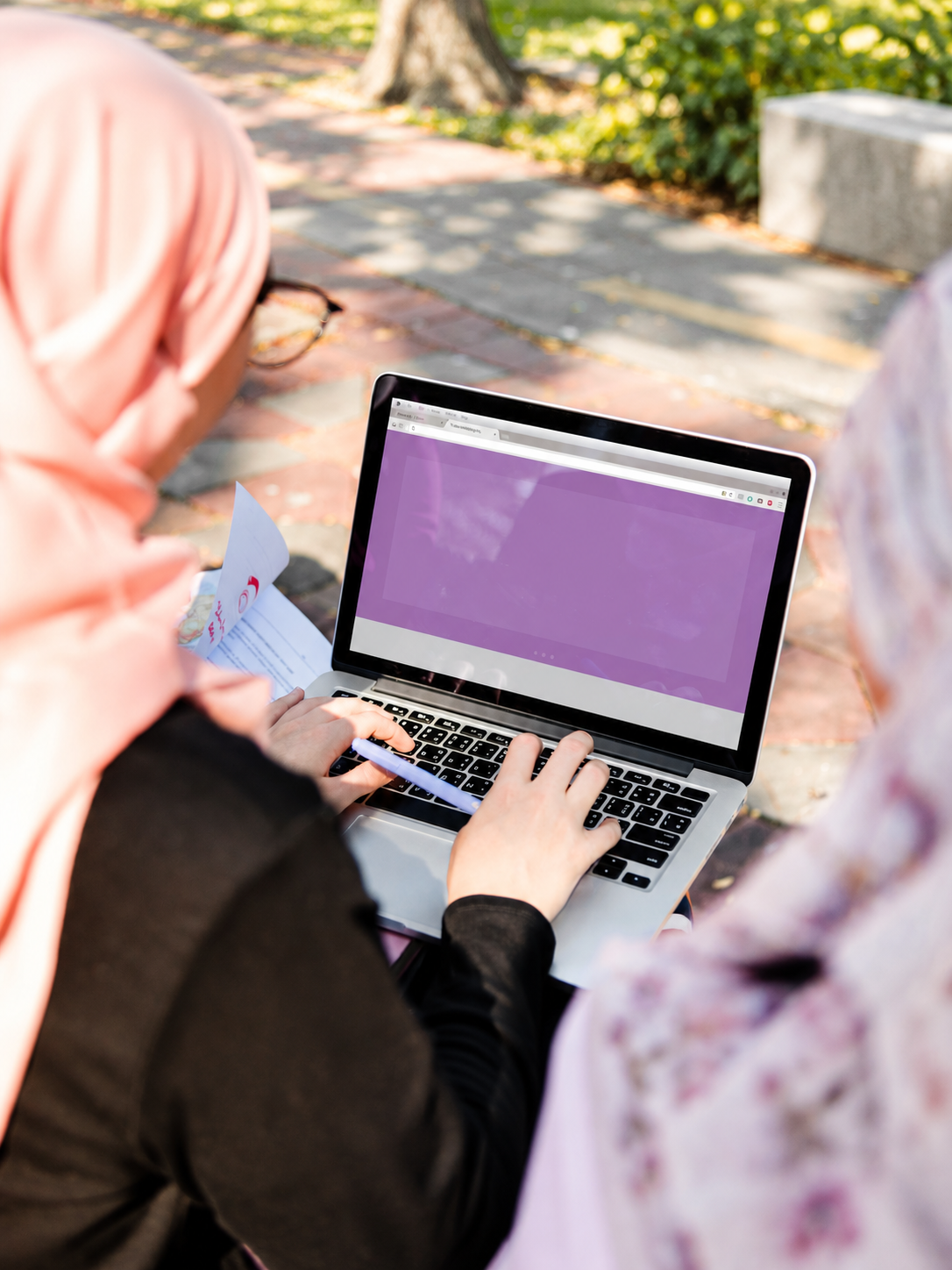 Person using a laptop to participate in a massive open online course