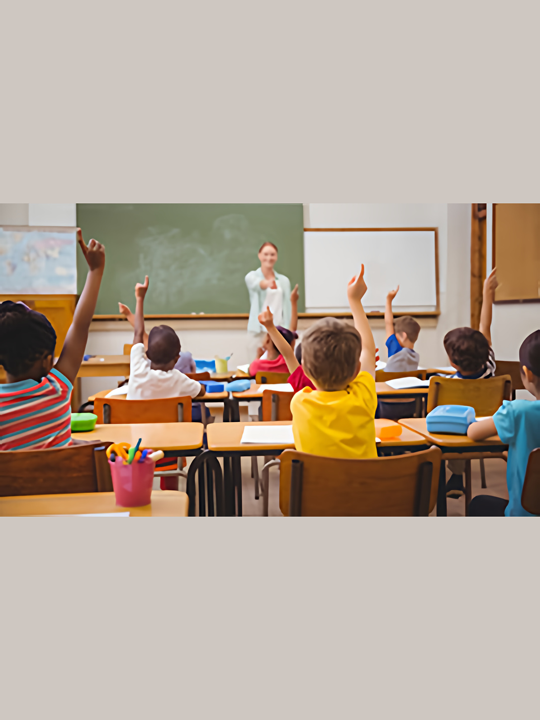 A teacher calls on students raising their hands in class.