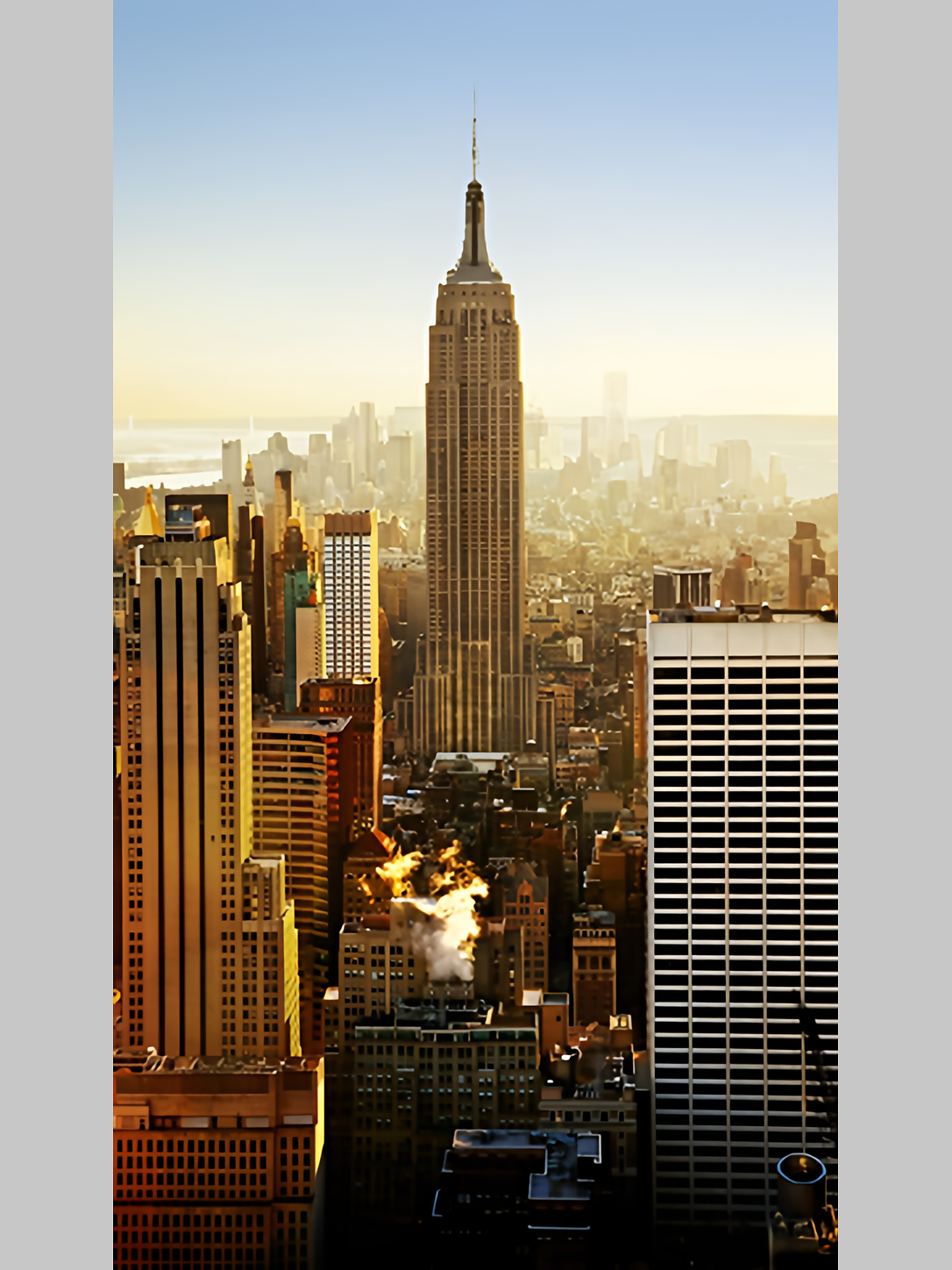The Empire State Building rises above the New York City skyline.